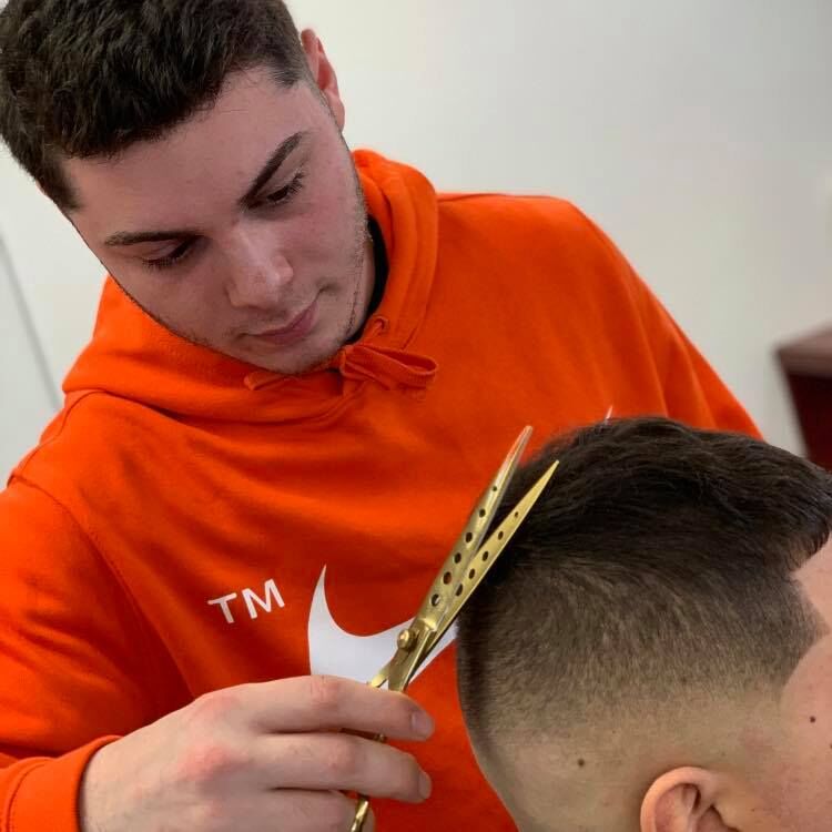 Spencer Newman cutting hair.jpg